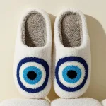 chaussons œil en peluche